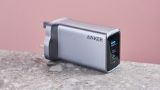 Anker Prime 100W GaN Wall Charger (3 Ports) on stone surface