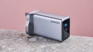 Anker Prime 100W GaN Wall Charger (3 Ports) on stone surface