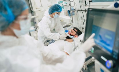 A COVID patient in a hospital bed