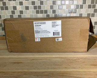 Black and Decker Dustbuster in cardboard packaging on kitchen worktop