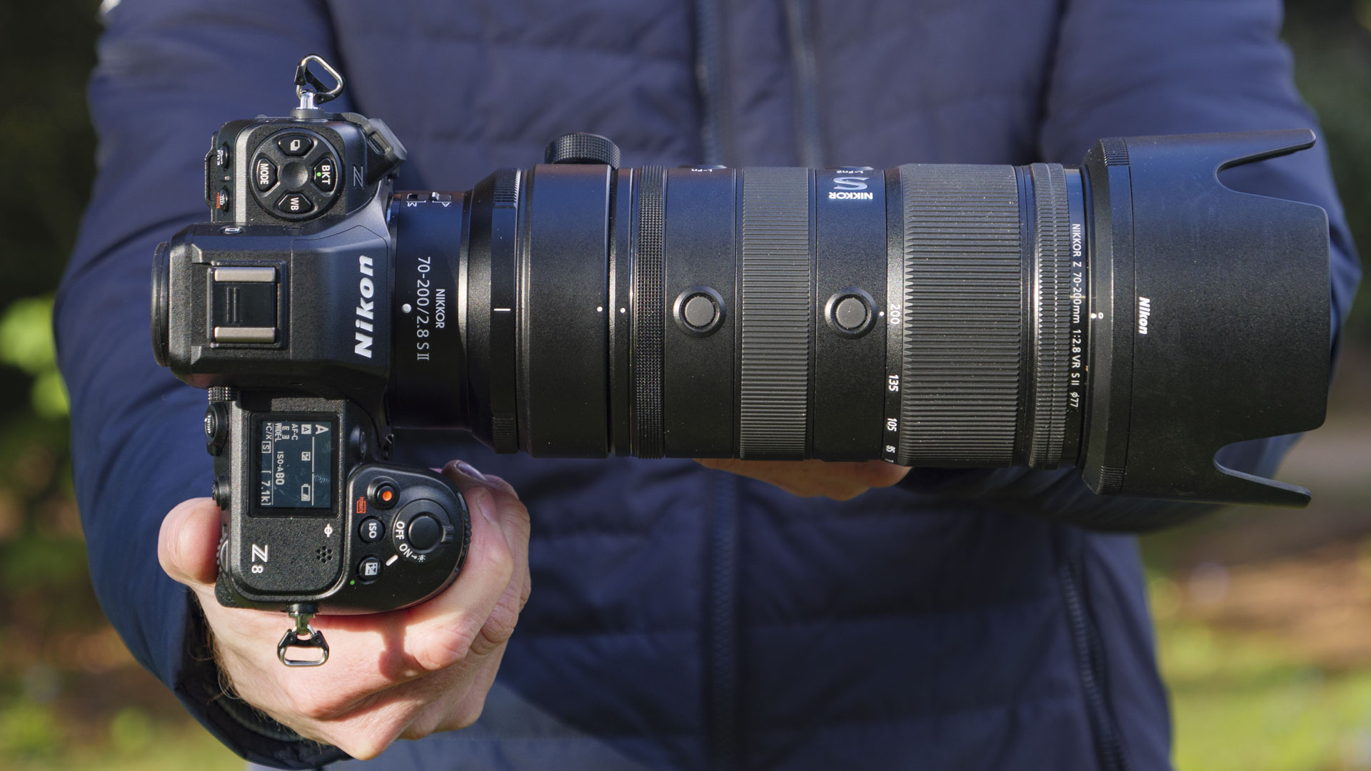 Man holding the Nikon Z8 camera with the Nikon Z 70-200mm f/2.8 VR S II lens attached