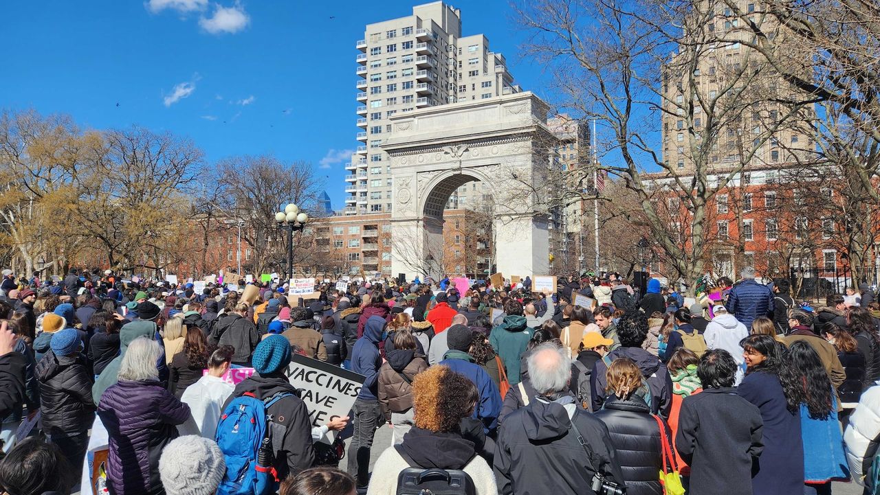 A large group of people marches at the Stand Up For Science rally
