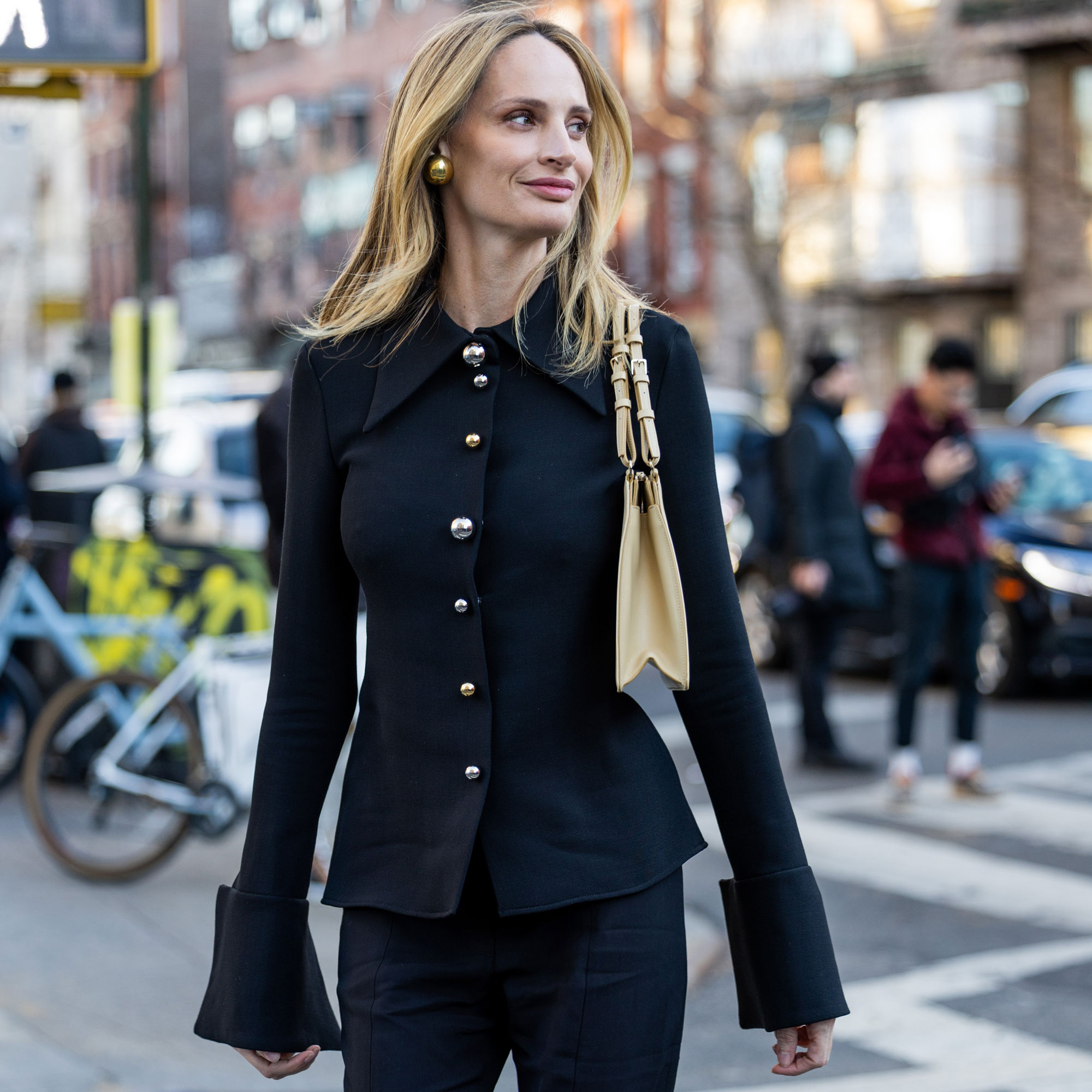 Lauren Santo Domingo wears a black sweater