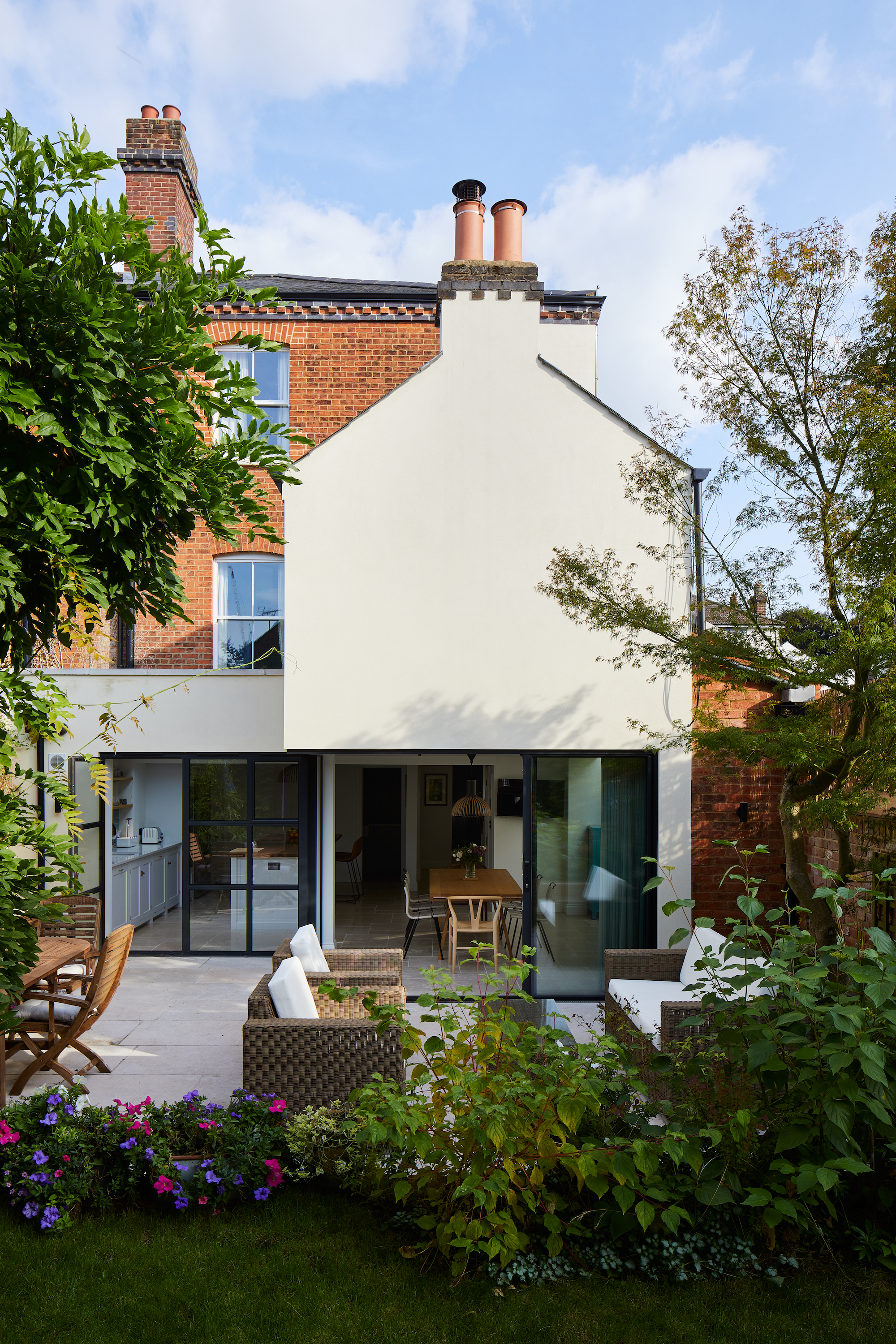 white rendered house extension with modern garden