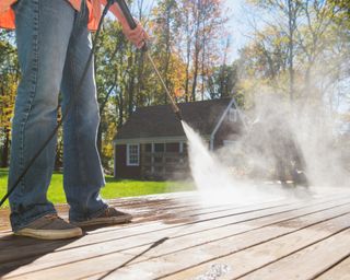 Man cleaning porch in New Jersey, USA