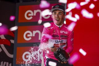 Valerio Conti celebrates his pink jersey on the podium