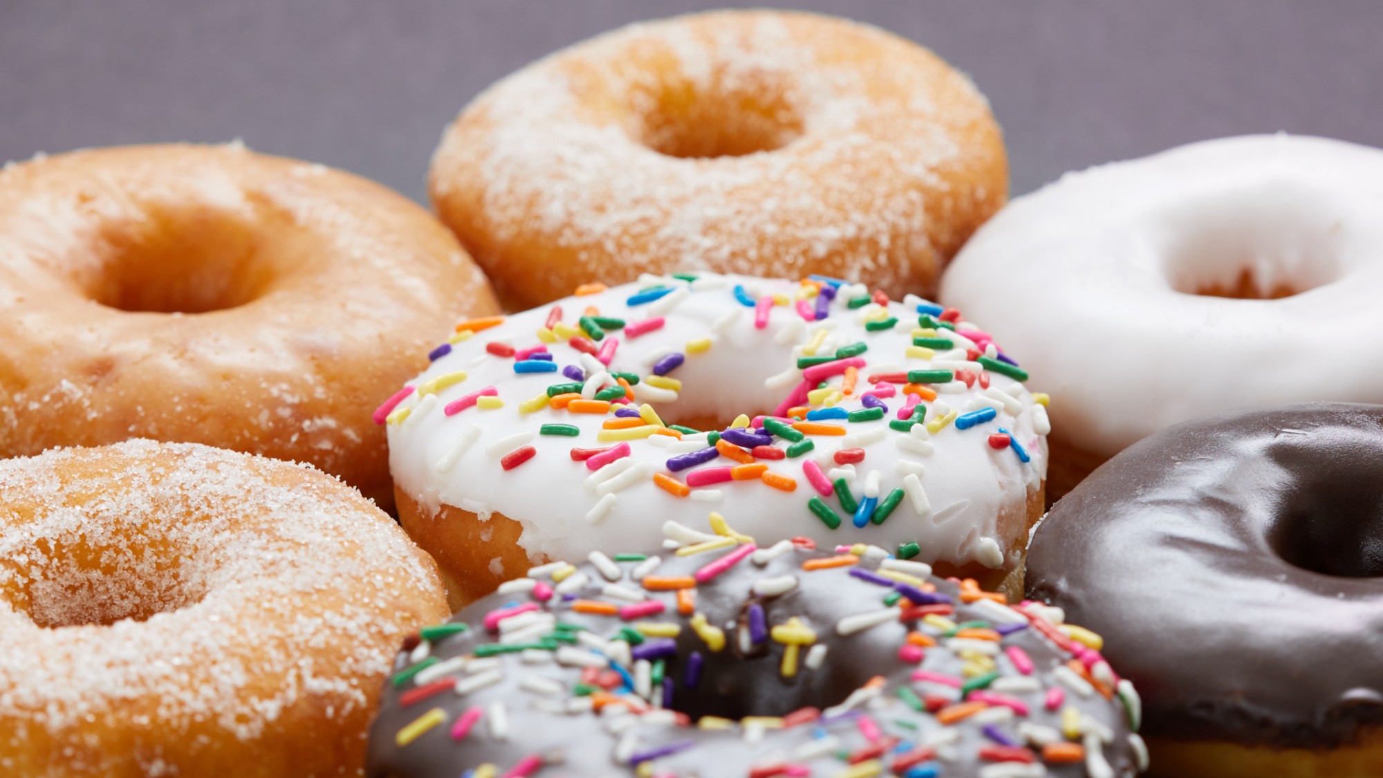 A stock photo of glazed donuts. 