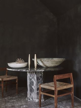 a dining area with dark painted limewash walls