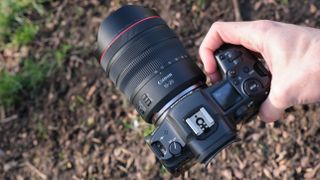 Canon RF 10-20mm F4L IS STM lens and mounted on a Canon EOS R5 camera held in a hand
