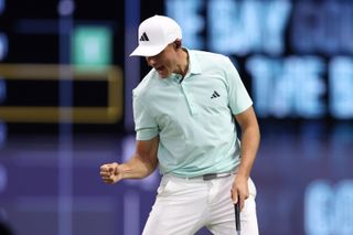 Ludvig Aberg celebrates holing a putt during a TGL match