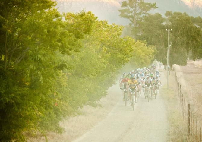 The front end of a dusty Cape Epic peloton