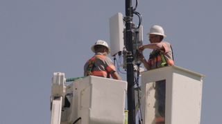 Verizon engineers installing a small cell in Indianapolis