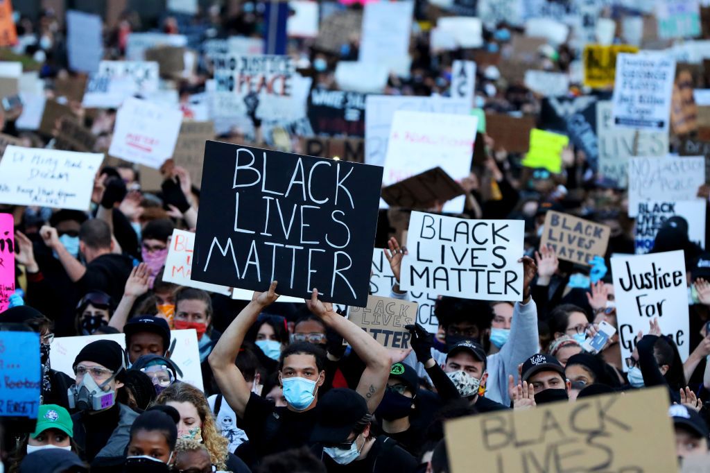 Demonstrators protest in response to the recent death of George Floyd on May 31, 2020 in Boston