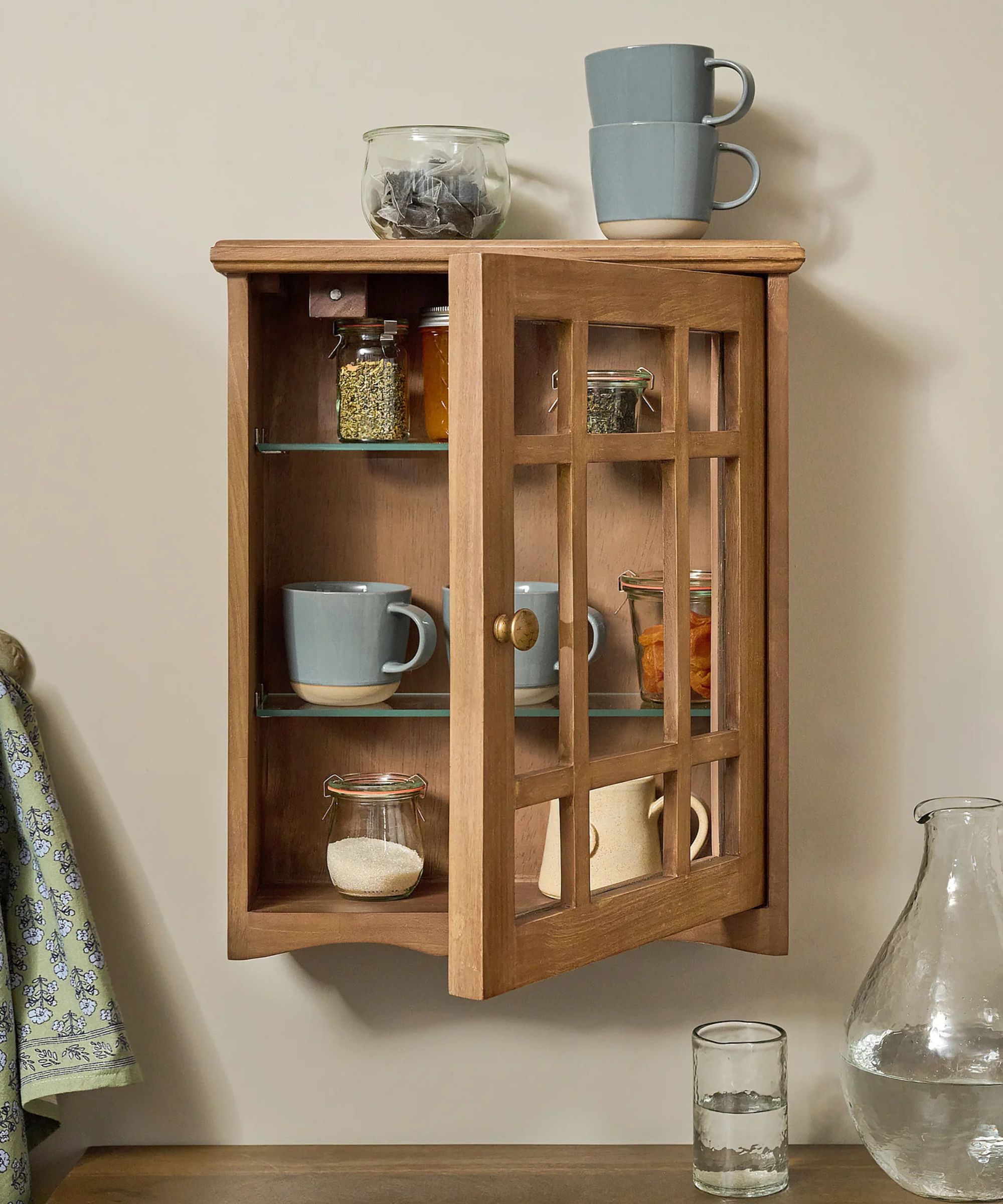 Small wooden cabinet with glass door