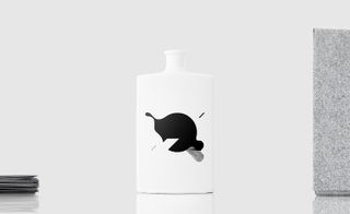 A bottle is white in color with small design in black