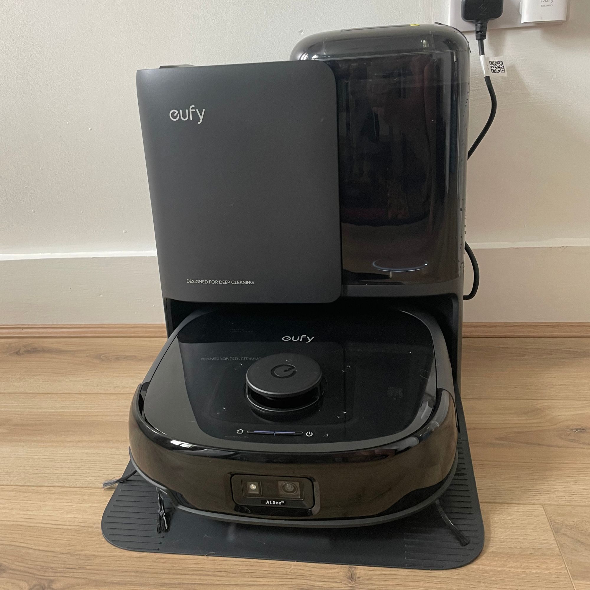 Eufy Robot Vacuum Omni E25 and the dock on wood-effect flooring