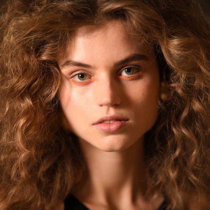 girl with dry shampoo in volumized hair