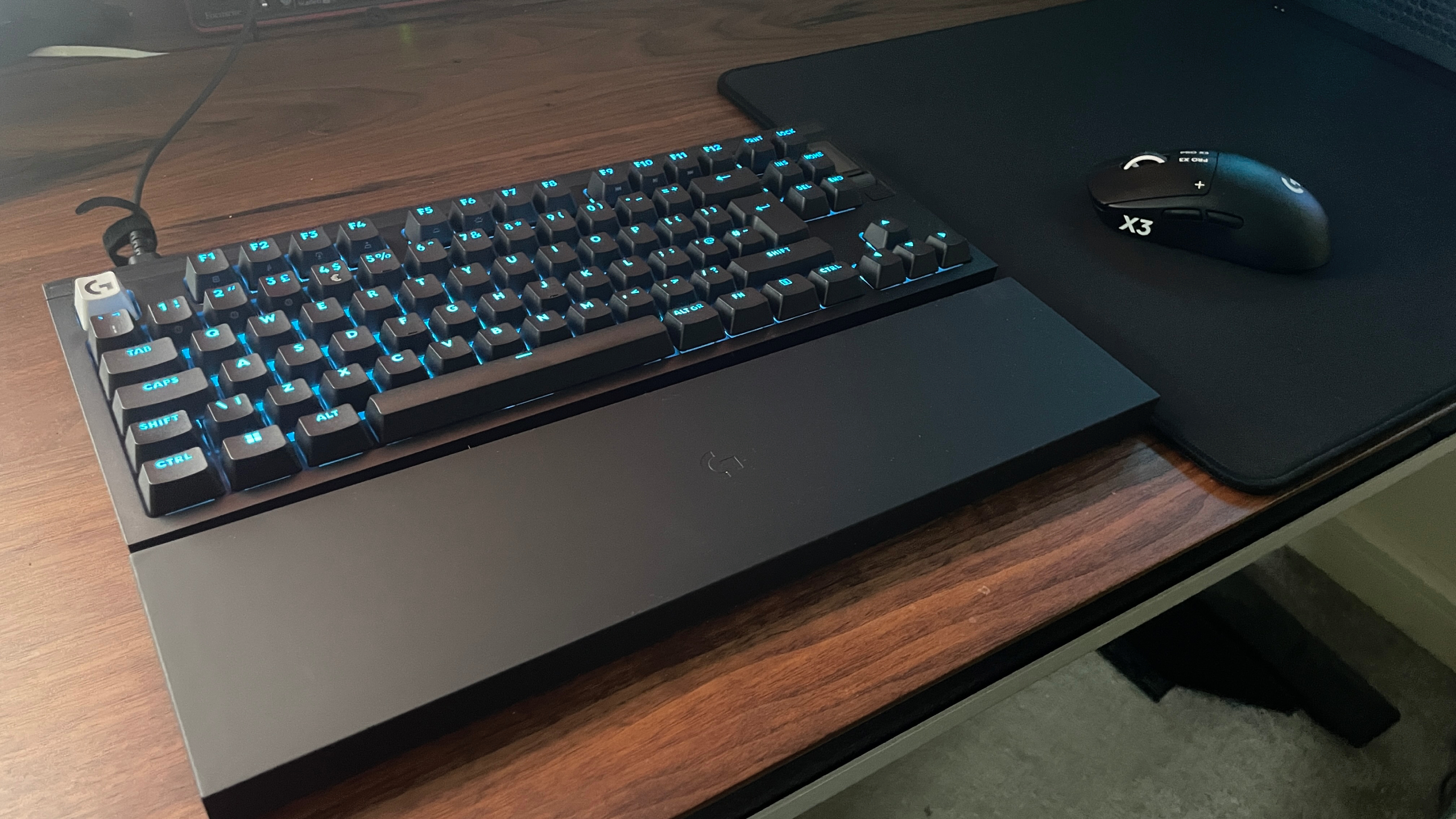 A Logitech G Pro X2 Rapid keyboard, G Pro X Control mouse pad, and G Pro X3 Superstrike gaming mouse on a desk.