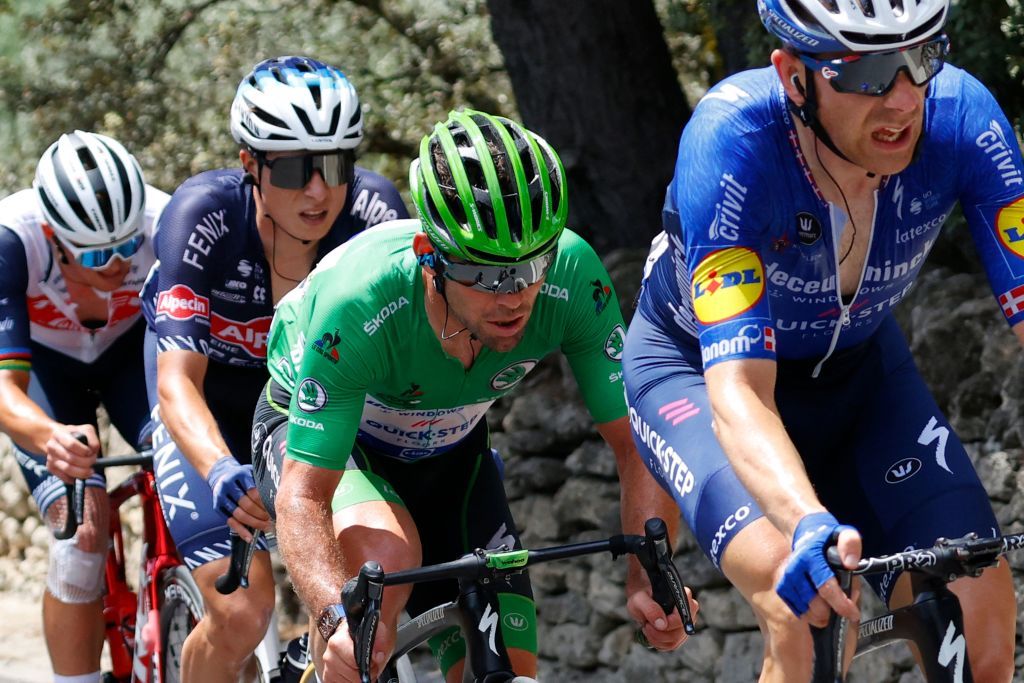 Team Deceuninck Quicksteps Mark Cavendish of Great Britain wearing the best sprinters green jersey 2ndR rides during the 11th stage of the 108th edition of the Tour de France cycling race 198 km between Sorgues and Malaucene on July 07 2021 Photo by Thomas SAMSON AFP Photo by THOMAS SAMSONAFP via Getty Images