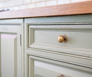 Well-used kitchen doors and worktop.