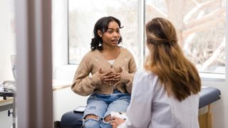 Woman speaking to doctor