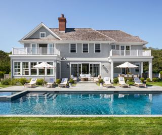 White clapboard Hamptons house with pool