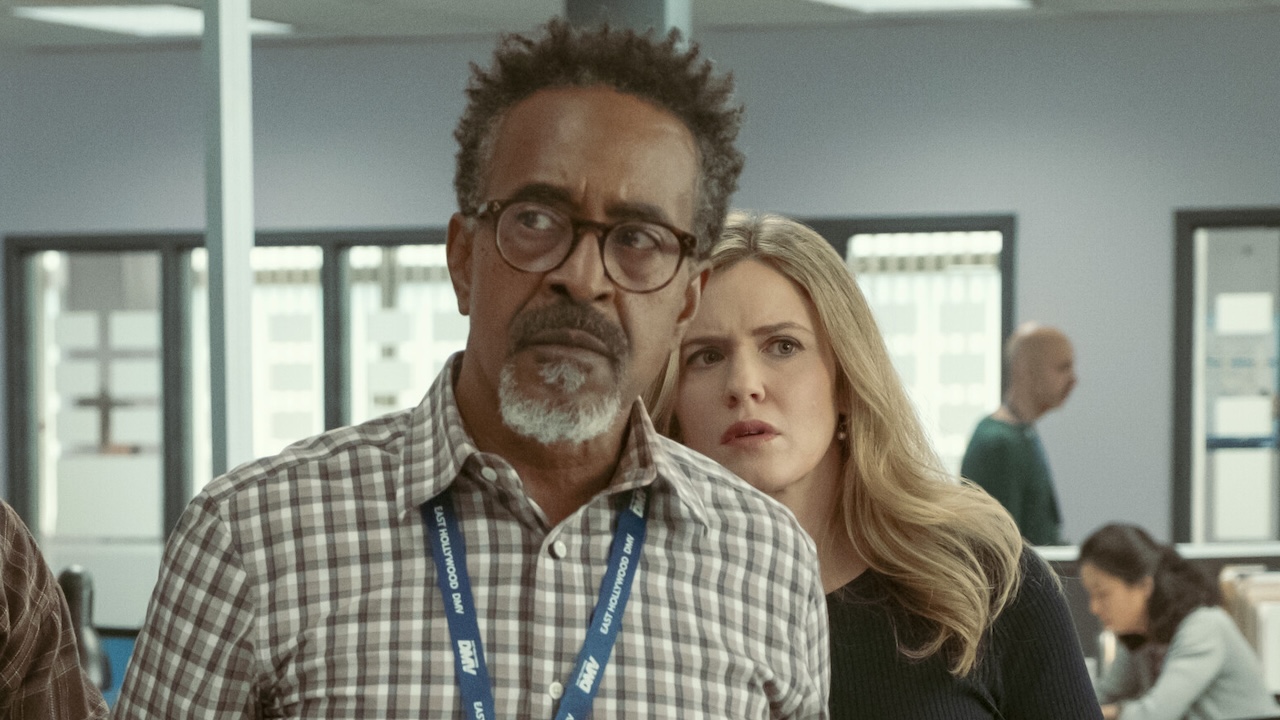 Greg and Collette looking off worriedly in DMV Season 1