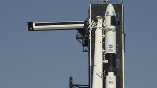 A SpaceX Falcon 9 rocket carrying the first Crew Dragon spacecraft to carry astronauts is raised atop its launch pad at Pad 39A of NASA's Kennedy Space Center on May 21, 2020. Liftoff is set for May 27.