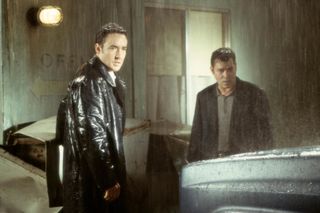 John Cusack and ray liotta standing in the rain in 'Identity'