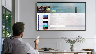 TV with live broadcasting channels on wall in living room 