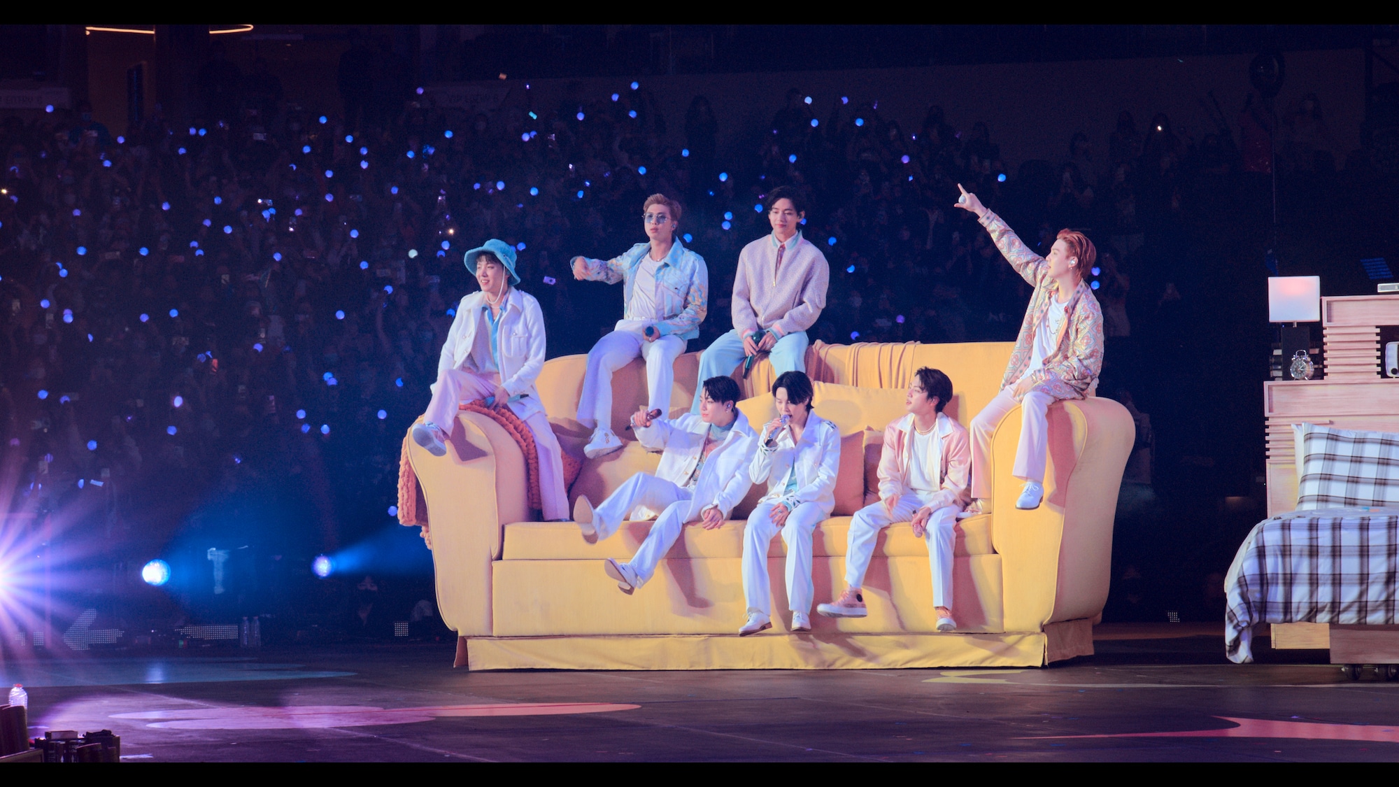 BTS permission to dance concert movie - featuring bts on an oversized yellow sofa