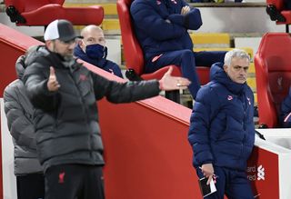 Liverpool manager Jurgen Klopp, left, with Spurs boss Jose Mourinho