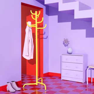 Purple room with red floor and yellow coat stand