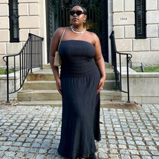 woman wearing black maxi dress and sunglasses