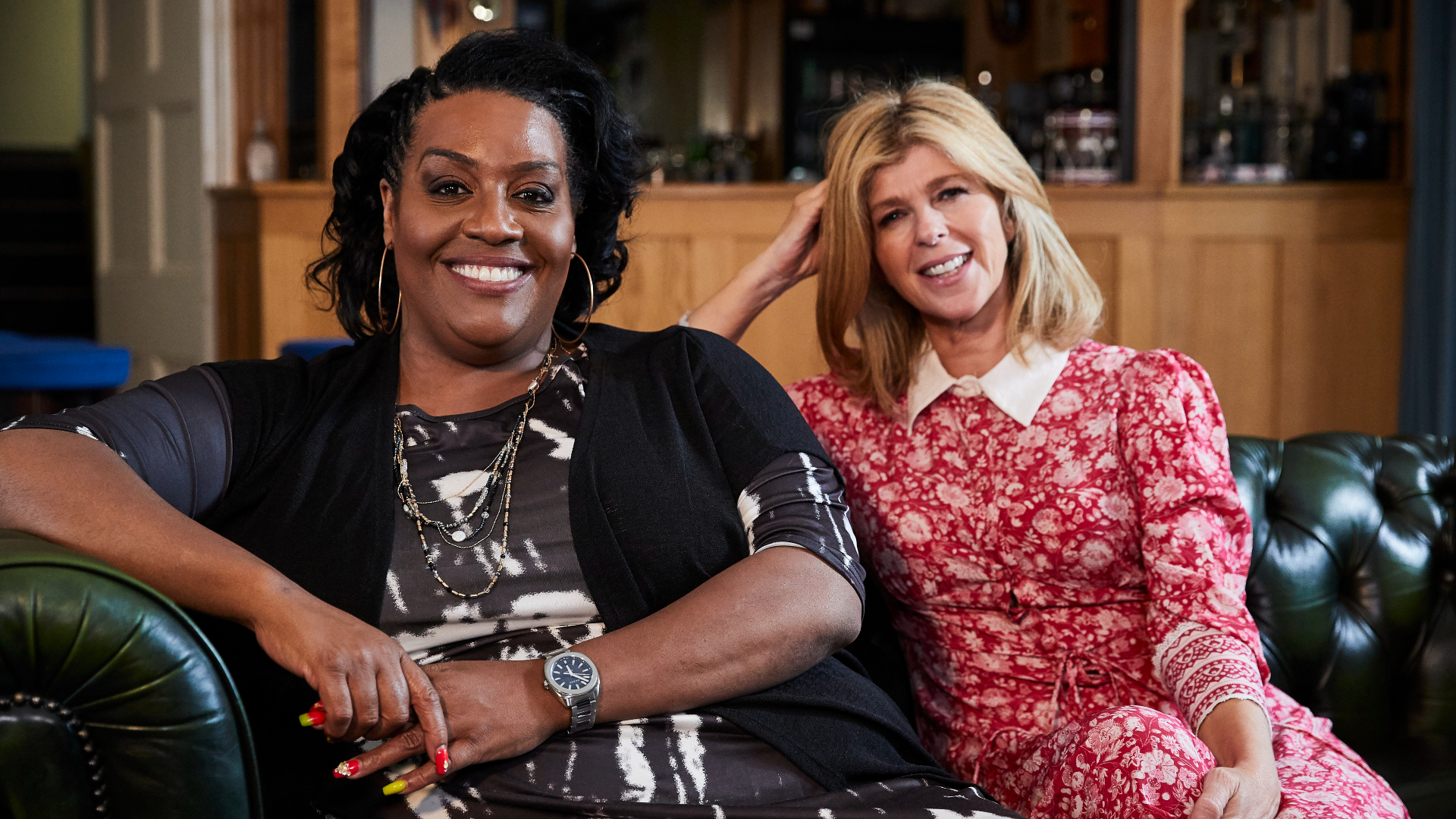 Alison Hammond and Kate Garraway sit together on a sofa