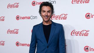Shawn Levy poses for photographs at a CinemaCon 2024 event