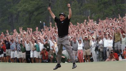 Phl Mickelson jumps in celebration after winning the 2004 Masters