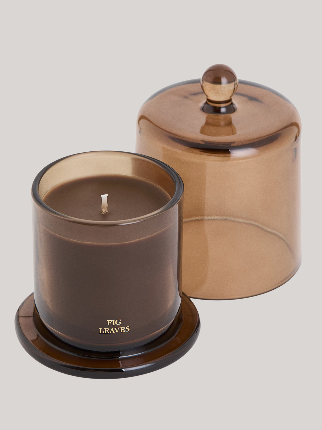 A brown glass fig leaves scented candle from H&amp;amp;M