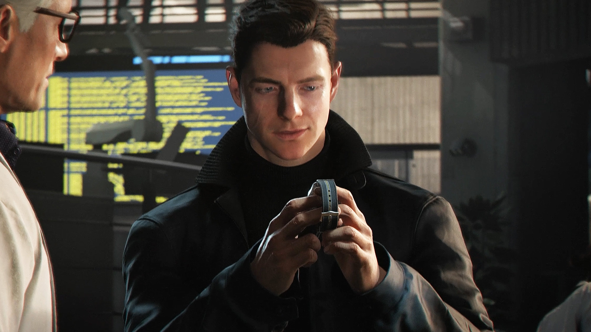 007 First Light - A young James Bond holding a watch and looking down at it