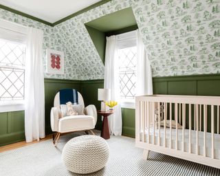Green boys nursery ideas with wall paneling and woodland wallpaper by Chasing Paper