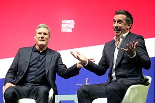 Labour leader Sir Keir Starmer speaks with Former England football player Gary Neville on day two of the Labour Party Conference at the ACC on September 26, 2022 in Liverpool, England The Labour Party hold their annual conference in Liverpool this year. Issues on the agenda are the cost of living crisis, including a call for a reinforced windfall tax, proportional representation and action on the climate crisis. (Photo by Christopher Furlong/Getty Images)