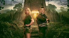 Holly Willoughby and Bear Grylls standing in front of a jungle fortress