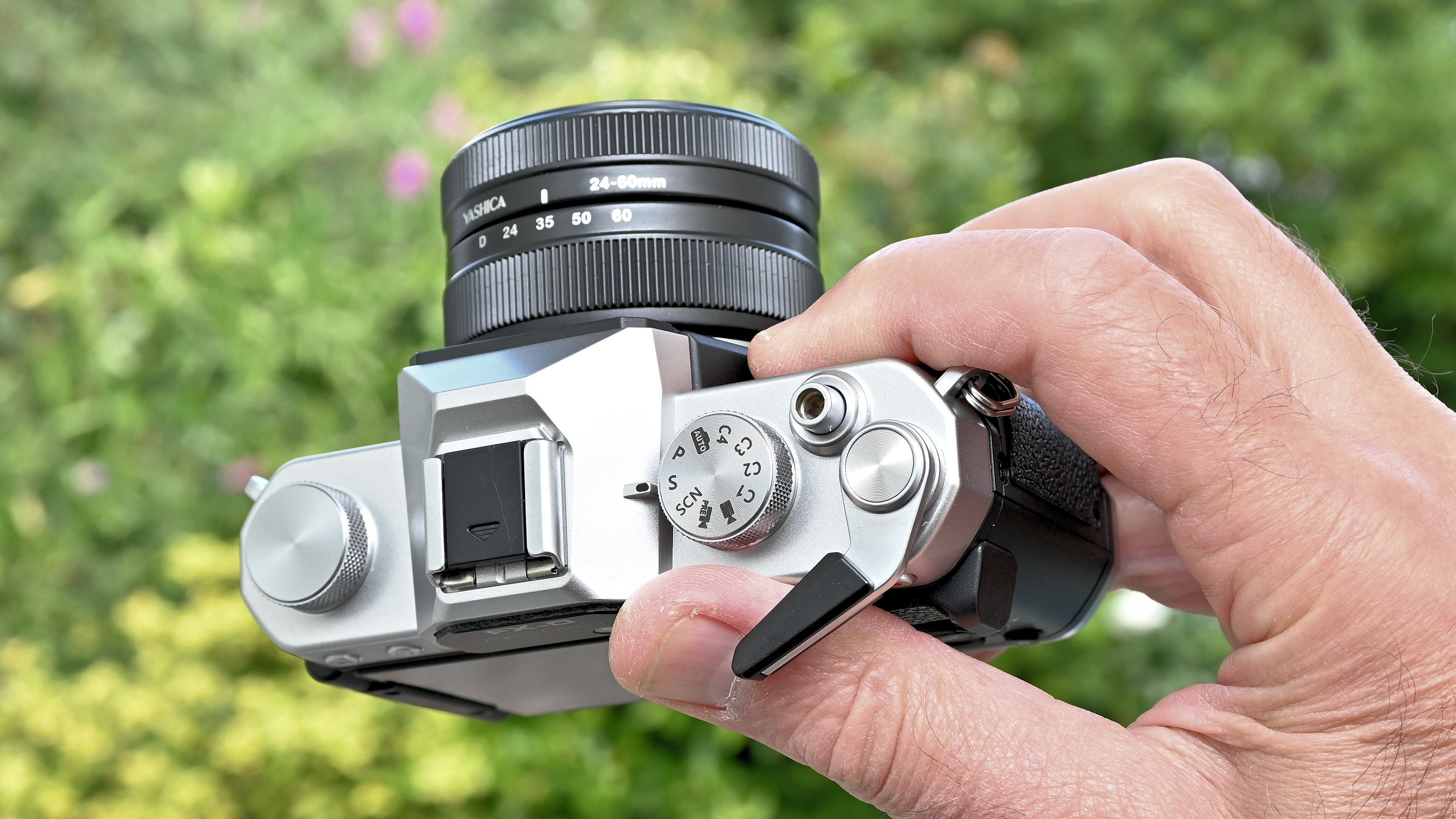 Yashica FX-D 300 product shot, camera held in hand