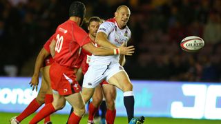 Mike Tindall of England chips the ball ahead