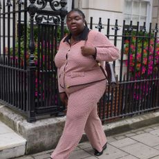 Influencer wears croc loafers.