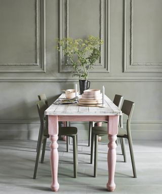 Gray-green dining table in a room designed by Annie Sloan