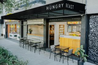 Street view of Hungry Beast, including the outdoor seating space