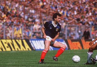 Davie Cooper playing for Scotland against England in 1983