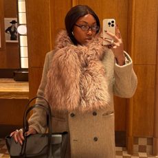 Nnenna Echem in a faux fur scarf and Sams&oslash;e Sams&oslash;e coat