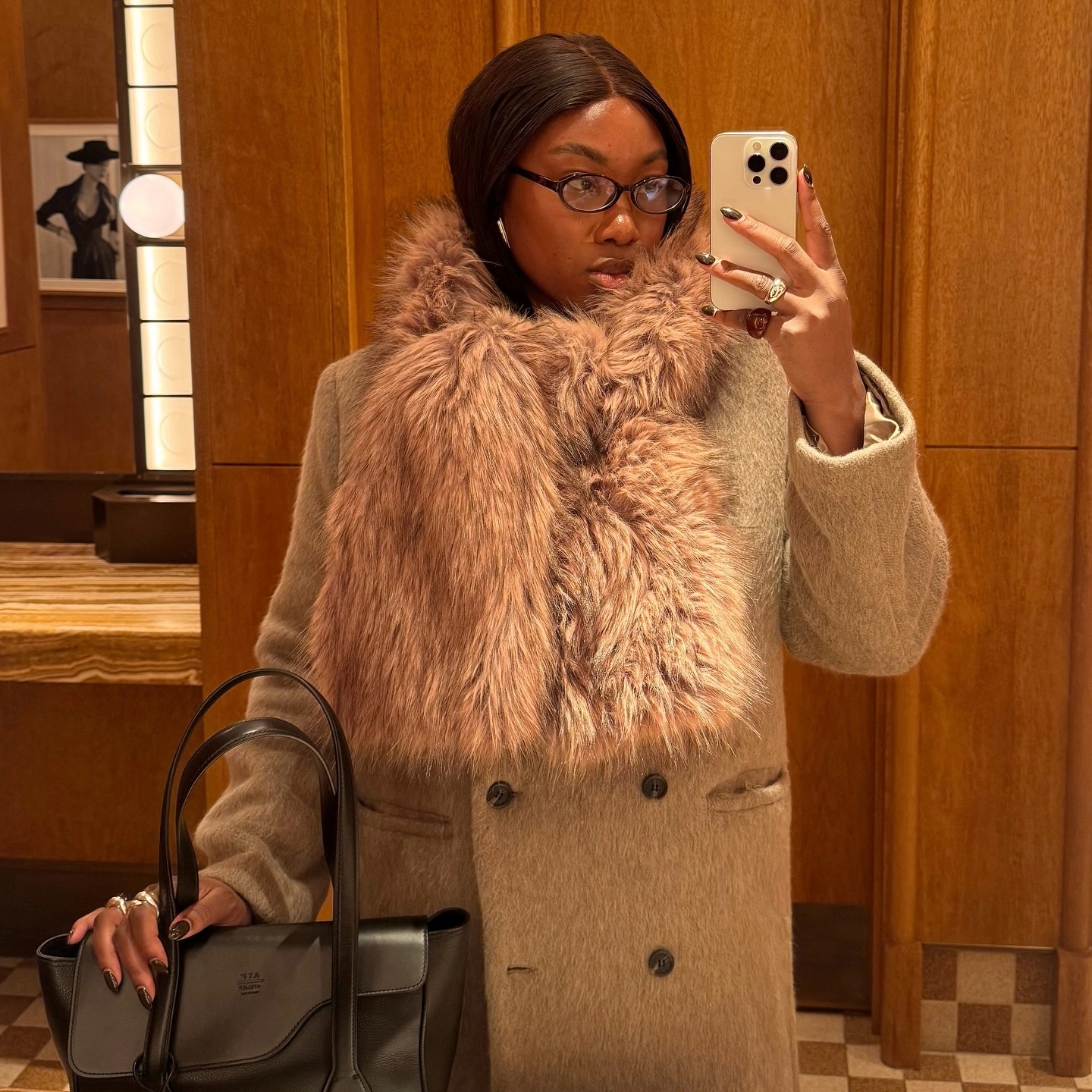 Nnenna Echem in a faux fur scarf and Sams&oslash;e Sams&oslash;e coat